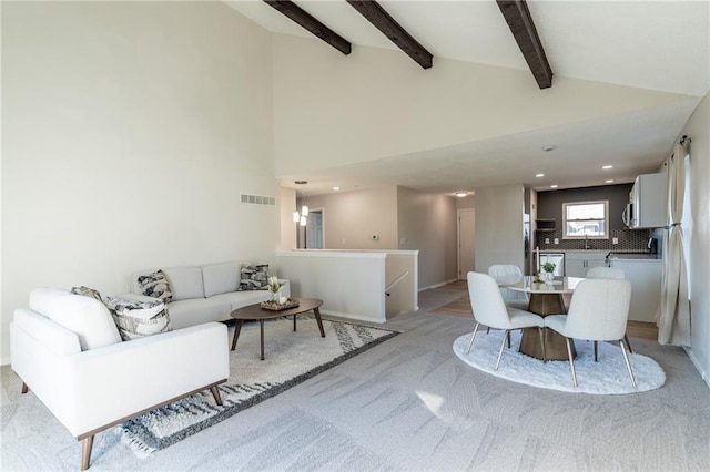 911 SE Hampton Ct, Lees Summit, MO 64063 - living room featuring beamed ceiling, recessed lighting, light carpet, and high vaulted ceiling