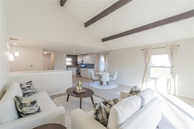 911 SE Hampton Ct, Lees Summit, MO 64063 - living area featuring beam ceiling, plenty of natural light, high vaulted ceiling, and light wood-type flooring