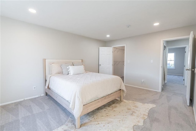 911 SE Hampton Ct, Lees Summit, MO 64063 - bedroom with light colored carpet, recessed lighting, and a walk in closet