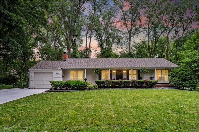 8315 Sagamore Rd, Leawood, KS 66206 - ranch-style home featuring driveway, a chimney, an attached garage, a front lawn, and covered porch