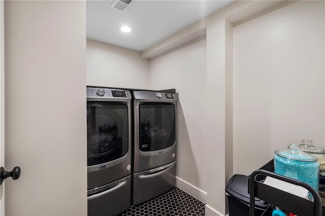 8315 Sagamore Rd, Leawood, KS 66206 - laundry area with separate washer and dryer and baseboards