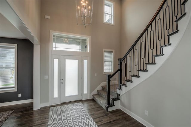 18421 Caenen St, Overland Park, KS 66013 - foyer entrance featuring a high ceiling, dark wood-style flooring, stairs, and a chandelier