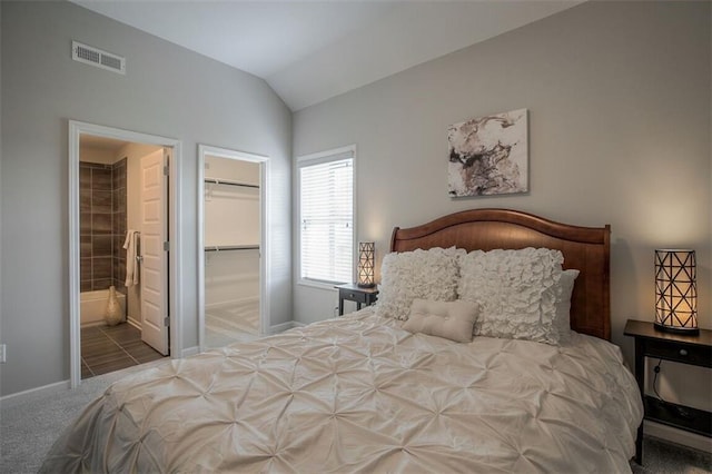 18421 Caenen St, Overland Park, KS 66013 - carpeted bedroom with vaulted ceiling, ensuite bath, a walk in closet, and a closet