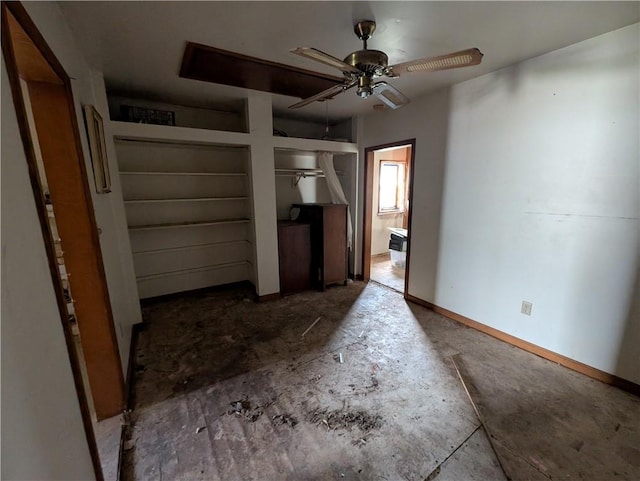 907 Scott Ave, Kansas City, KS 66105 - unfurnished bedroom with ensuite bath, multiple closets, and a ceiling fan