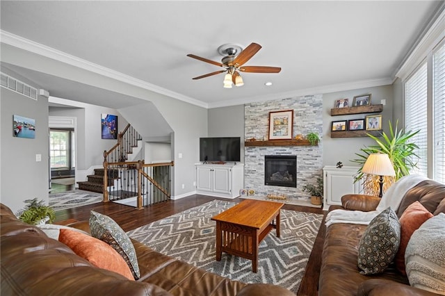 21502 W 98th Ter, Lenexa, KS 66220 - living area with ceiling fan, wood finished floors, stairs, crown molding, and a stone fireplace