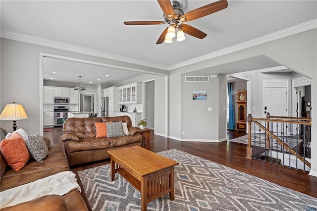 21502 W 98th Ter, Lenexa, KS 66220 - living area featuring dark wood-style flooring, a ceiling fan, ornamental molding, and recessed lighting