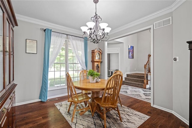21502 W 98th Ter, Lenexa, KS 66220 - dining space featuring a chandelier, stairs, crown molding, and dark wood-type flooring