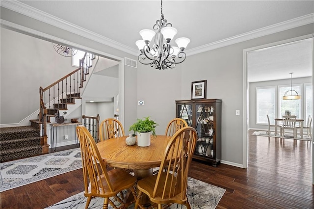 21502 W 98th Ter, Lenexa, KS 66220 - dining room with stairway, crown molding, hardwood / wood-style flooring, and a chandelier