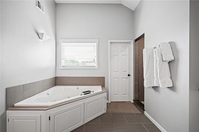 21502 W 98th Ter, Lenexa, KS 66220 - bathroom with a jetted tub, high vaulted ceiling, and a shower stall