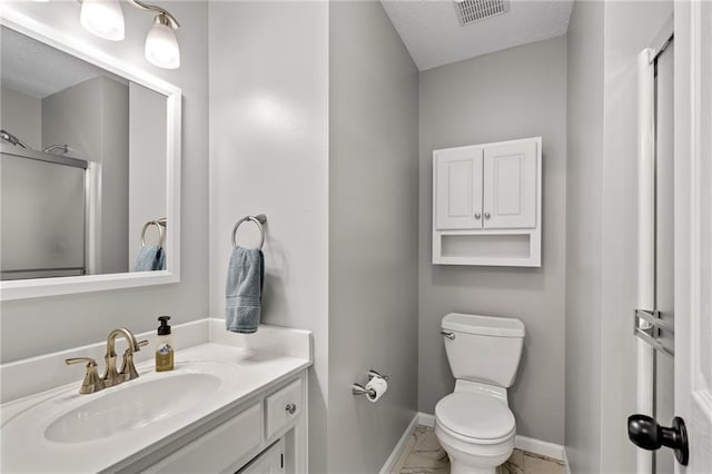 21502 W 98th Ter, Lenexa, KS 66220 - full bath with marble look tiles, vanity, a textured ceiling, and a shower with shower door