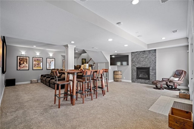 21502 W 98th Ter, Lenexa, KS 66220 - carpeted dining space featuring recessed lighting, a stone fireplace, and ornate columns