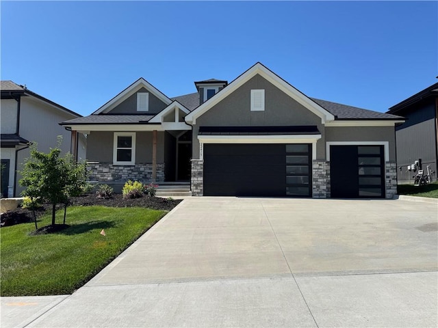 22415 87th Ter, Lenexa, KS 66227 - view of front of property featuring stucco siding, stone siding, a garage, and a front yard