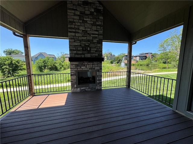 22415 87th Ter, Lenexa, KS 66227 - deck with an outdoor stone fireplace, a yard, and a residential view