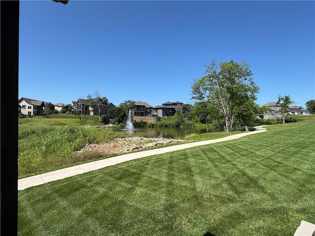 22415 87th Ter, Lenexa, KS 66227 - view of grassy yard with a residential view and a water view