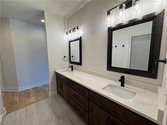 22415 87th Ter, Lenexa, KS 66227 - full bathroom with double vanity and wood finished floors