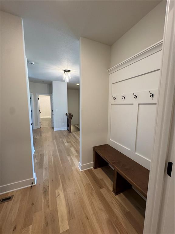 22415 87th Ter, Lenexa, KS 66227 - mudroom with light wood-style floors and baseboards
