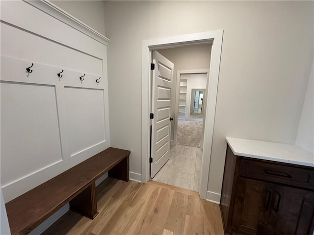22415 87th Ter, Lenexa, KS 66227 - mudroom with light wood finished floors and baseboards
