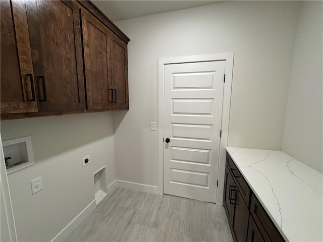 22415 87th Ter, Lenexa, KS 66227 - washroom with cabinet space, electric dryer hookup, washer hookup, and light wood-type flooring