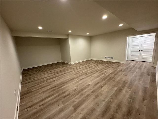 22415 87th Ter, Lenexa, KS 66227 - finished below grade area featuring recessed lighting and wood finished floors