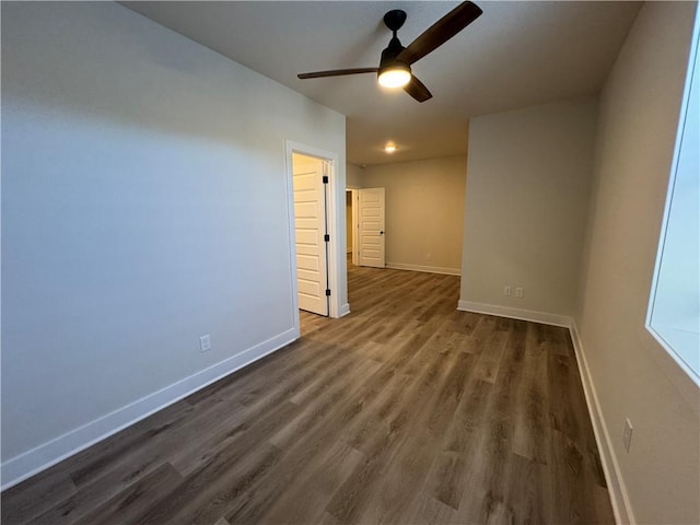 22415 87th Ter, Lenexa, KS 66227 - unfurnished room with ceiling fan and dark wood-type flooring