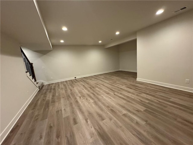 22415 87th Ter, Lenexa, KS 66227 - finished below grade area with recessed lighting, wood finished floors, and stairway