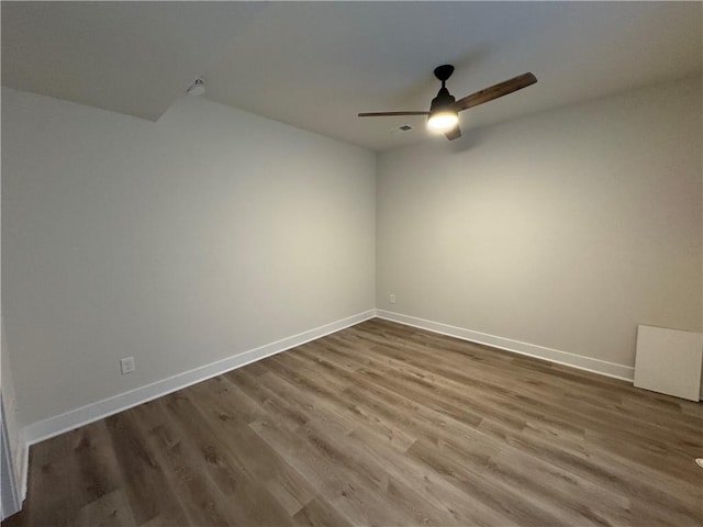 22415 87th Ter, Lenexa, KS 66227 - unfurnished room featuring a ceiling fan and dark wood finished floors
