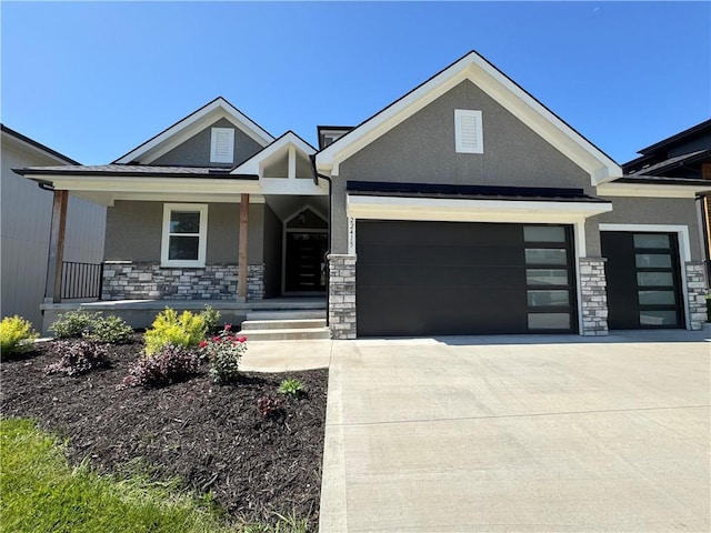 22415 87th Ter, Lenexa, KS 66227 - view of front of house with stone siding, an attached garage, and stucco siding