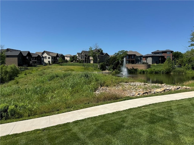 22415 87th Ter, Lenexa, KS 66227 - view of grassy yard with a residential view and a water view