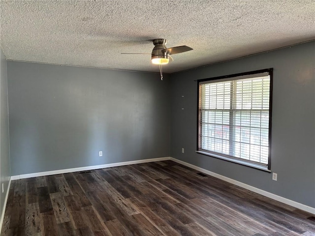 18105 E 18th Ter N, Independence, MO 64058 - empty room featuring plenty of natural light, dark wood-type flooring, a ceiling fan, and a textured ceiling