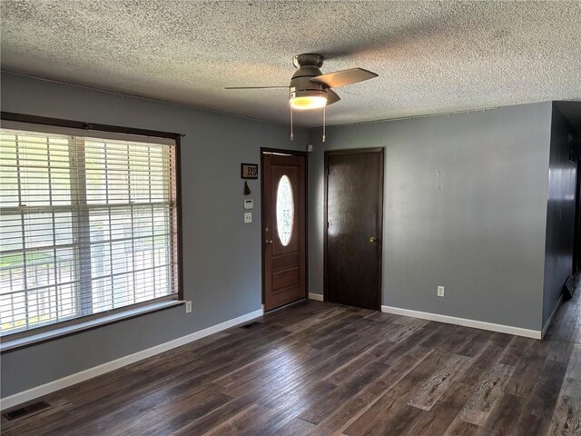 18105 E 18th Ter N, Independence, MO 64058 - entryway featuring healthy amount of natural light, a textured ceiling, dark wood-style floors, and a ceiling fan