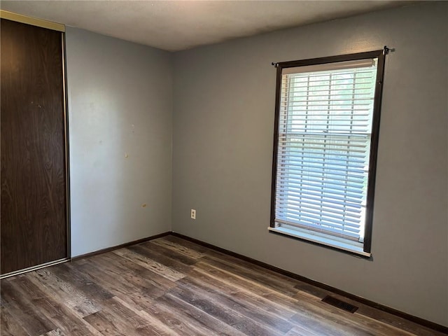18105 E 18th Ter N, Independence, MO 64058 - empty room with wood finished floors and plenty of natural light