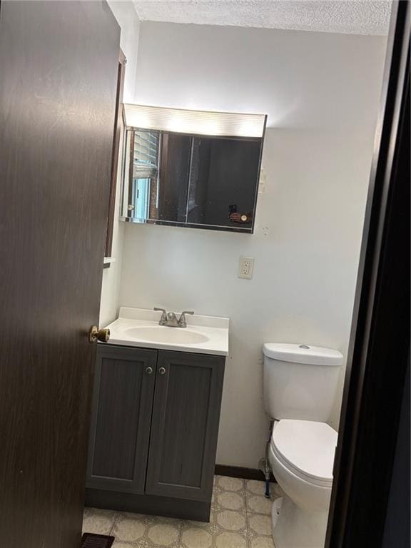 18105 E 18th Ter N, Independence, MO 64058 - half bath featuring vanity, tile patterned floors, and a textured ceiling
