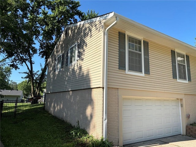 18105 E 18th Ter N, Independence, MO 64058 - view of side of property with a garage and brick siding