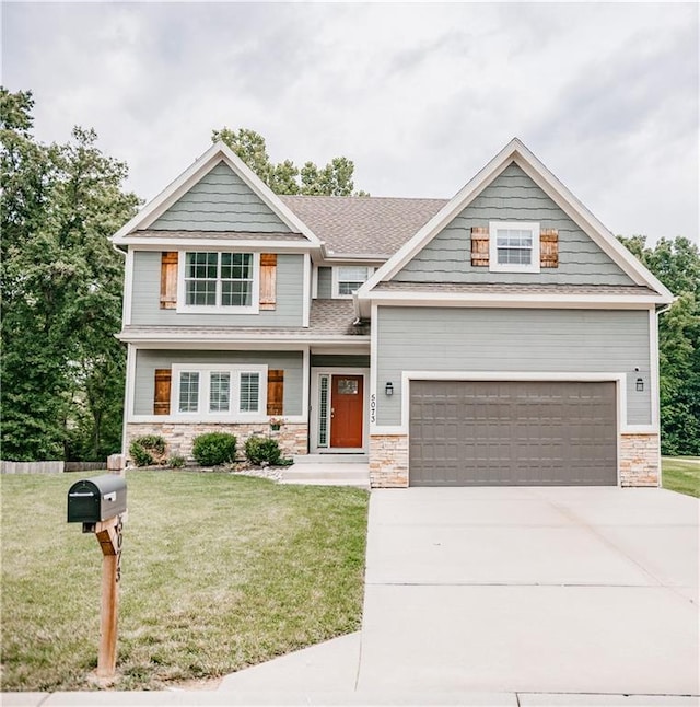 5073 NW Timberline Dr, Riverside, MO 64150 - craftsman inspired home with stone siding, concrete driveway, a front yard, and a shingled roof