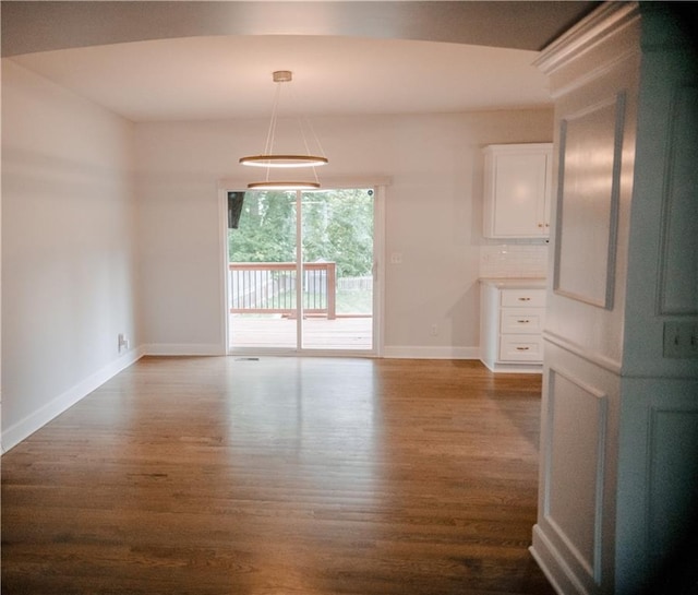 5073 NW Timberline Dr, Riverside, MO 64150 - spare room featuring dark wood finished floors and baseboards