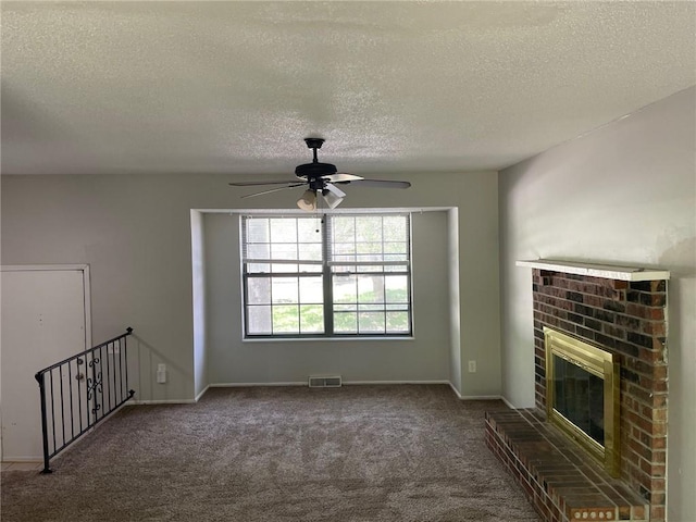 3212 Canterbury Rd, Blue Springs, MO 64015 - unfurnished living room featuring carpet floors, a textured ceiling, a ceiling fan, and a brick fireplace