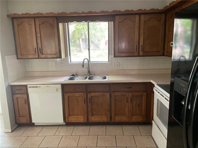 3212 Canterbury Rd, Blue Springs, MO 64015 - kitchen featuring white appliances, light countertops, backsplash, and brown cabinets