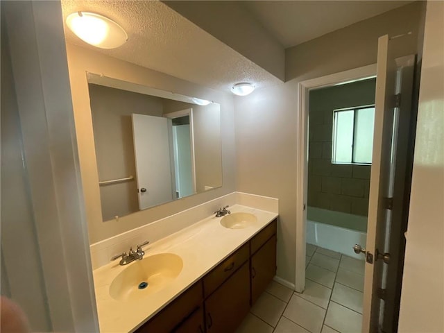 3212 Canterbury Rd, Blue Springs, MO 64015 - full bath featuring tile patterned floors, double vanity, and a textured ceiling