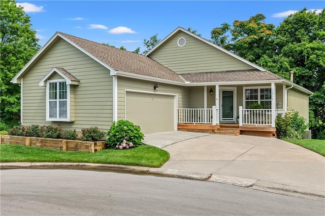 17014 E 45th St S, Independence, MO 64055 - ranch-style house featuring covered porch, a garage, driveway, and roof with shingles