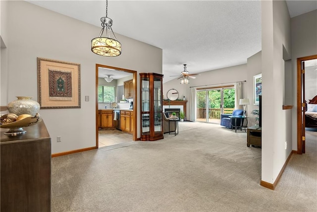 17014 E 45th St S, Independence, MO 64055 - living area featuring a fireplace, light colored carpet, and ceiling fan