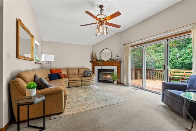 17014 E 45th St S, Independence, MO 64055 - living area featuring vaulted ceiling, ceiling fan, carpet floors, and a tile fireplace