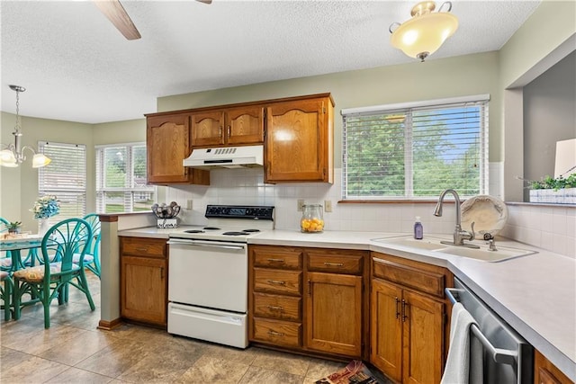 17014 E 45th St S, Independence, MO 64055 - kitchen featuring white electric stove, under cabinet range hood, a textured ceiling, brown cabinets, and decorative backsplash