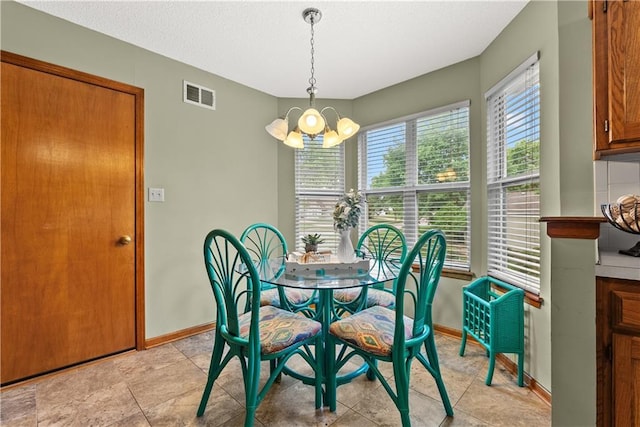 17014 E 45th St S, Independence, MO 64055 - dining room featuring a chandelier and baseboards