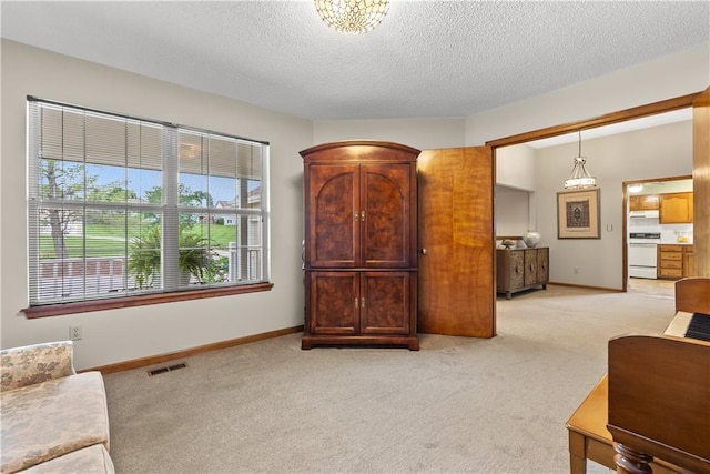 17014 E 45th St S, Independence, MO 64055 - living room featuring light colored carpet and a textured ceiling
