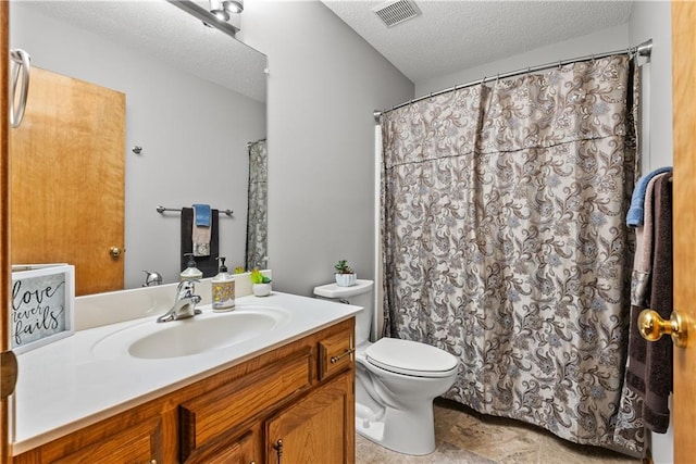 17014 E 45th St S, Independence, MO 64055 - full bath with a textured ceiling, vanity, and stone finish floors