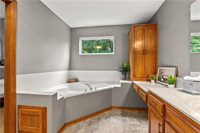 17014 E 45th St S, Independence, MO 64055 - bathroom featuring plenty of natural light, vanity, and a garden tub