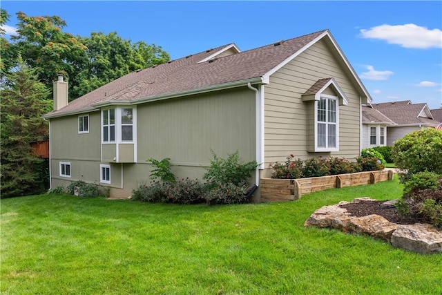 17014 E 45th St S, Independence, MO 64055 - view of side of property with a lawn, a chimney, and roof with shingles