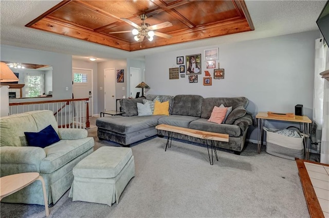 2013 NE Summerfield Ct, Blue Springs, MO 64029 - carpeted living area featuring a ceiling fan and a tray ceiling