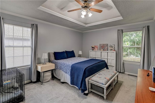 2013 NE Summerfield Ct, Blue Springs, MO 64029 - bedroom featuring a raised ceiling, light colored carpet, ornamental molding, ceiling fan, and a textured ceiling