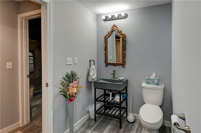 2013 NE Summerfield Ct, Blue Springs, MO 64029 - bathroom with wood finished floors and toilet